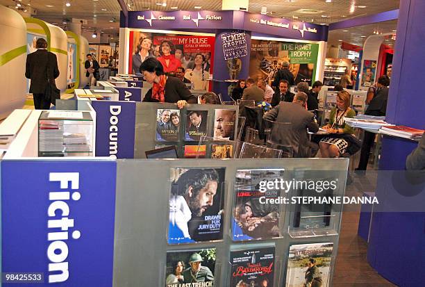 Picture taken on April 13, 2010 in Cannes, southern France, shows people visiting a stand during the MIPTV, one of the world's largest broadcasting...