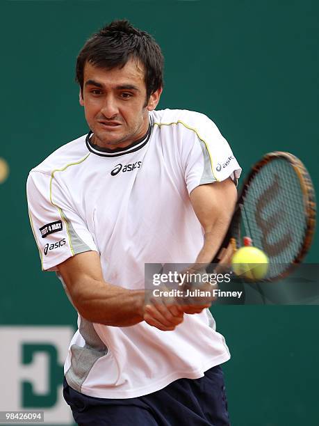 Florent Serra of France plays a backhand in his match against Stephane Robert of France during day two of the ATP Masters Series at the Monte Carlo...