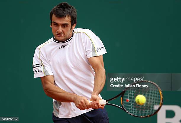 Florent Serra of France plays a backhand in his match against Stephane Robert of France during day two of the ATP Masters Series at the Monte Carlo...