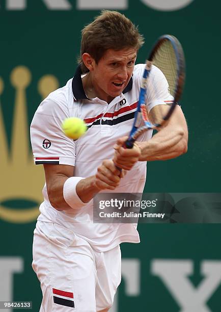 Igor Andreev of Russia plays a backhand in his match against Marin Cilic of Croatia during day two of the ATP Masters Series at the Monte Carlo...