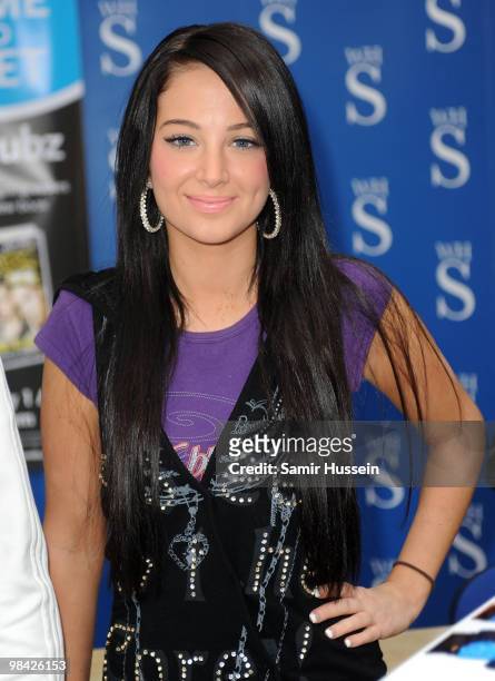 Tula "Tulisa" Contostavlos of N-Dubz poses at a photocall for the launch of the group's book 'Against All Odds: From Street Life to Chart Life' at...