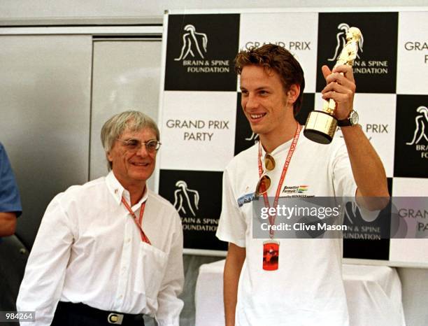 Jenson Button of Great Britain recieves his bernie award from Bernie Ecclestone during the Spanish Grand Prix at the Circuit de Catalunya, Barcelona,...