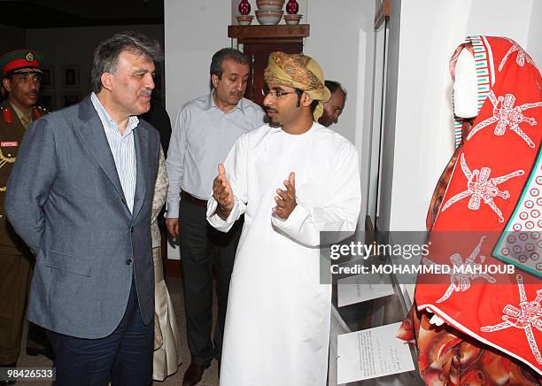 Turkish President Abdullah Gul listens to an Omani guide during a visit to the Bait al-Zubair Museum in the old city of Muscat on April 13, 2010. Gul...