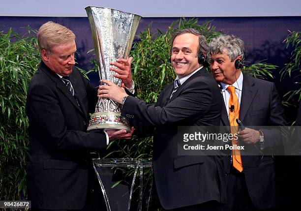 Mayor of Hamburg Ole Von Beust gets the UEFA Europa League cup from UEFA president Michel Platini during to the handover of the UEFA Europa League...