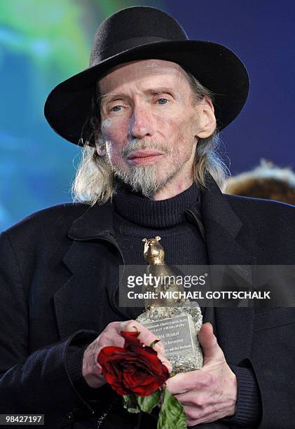 Picture taken on February 19, 2010 shows German film director Werner Schroeter posing for a photo after receiving the Special Teddy Award for his...