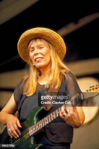 Joni Mitchell perfoming at the New Orleans Jazz & Heritage Festival on May 6, 1995.