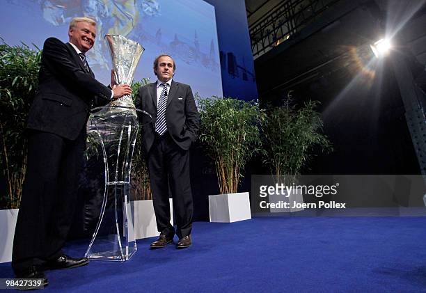 Mayor of Hamburg Ole Von Beust and UEFA president Michel Platini pictured with the UEFA Europa League cup during to the handover of the UEFA Europa...