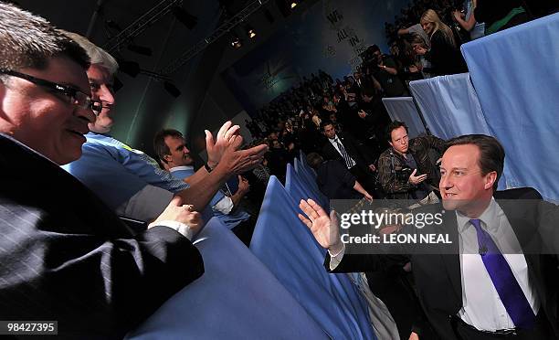 British oppostion Conservative party leader David Cameron waves as he leaves his party's election manifesto launch at Battersea Power Station in...