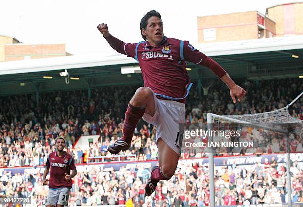 West Ham United's Mexican player Guillermo Franco celebrates after scoring a goal before being realising it was disallowed for hand ball during a...
