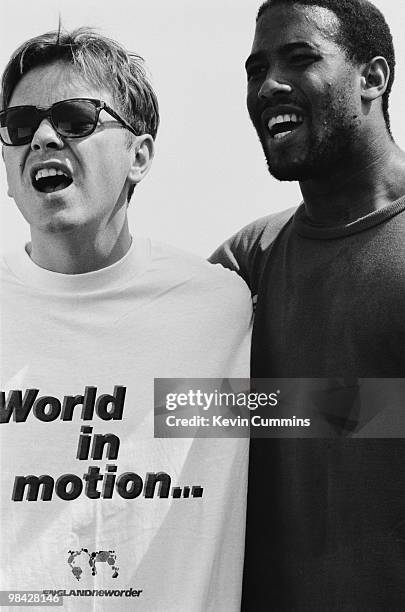 Singer Bernard Sumner of English rock group New Order with footballer John Barnes whilst filming the video for the official song of the England...