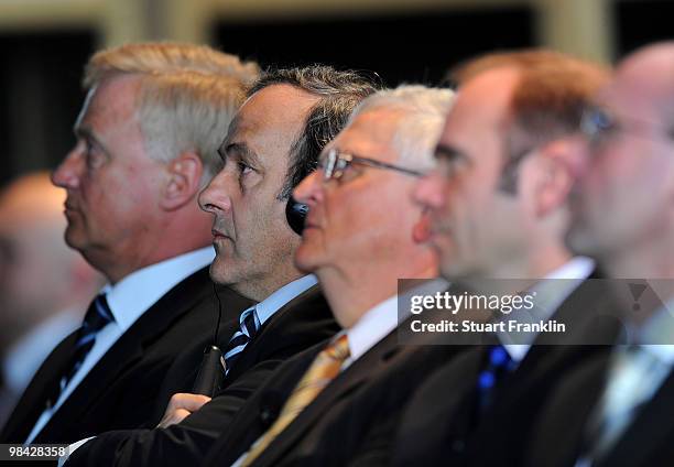 President Michel Platini sits with Theo Zwanziger, president of the German Football Association during the handover of the UEFA Europa League cup on...