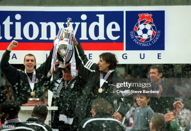 Chris Coleman, Andy Melville and Chairman Mohamed Al Fayed of Fulham celebrate with the Division One Trophy after the Nationwide Division One match...