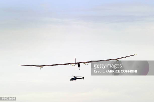 The Solar Impulse aircraft, a pioneering Swiss bid to fly around the world on solar energy glides prior to landing after it first test flight on...
