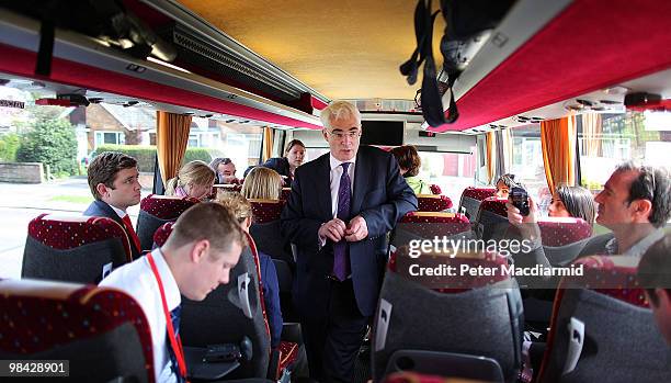 Chancellor of the Exchequer Alistair Darling talks to reporters on the Labour Party election tour bus on April 13, 2010 in Erewash, England.The...