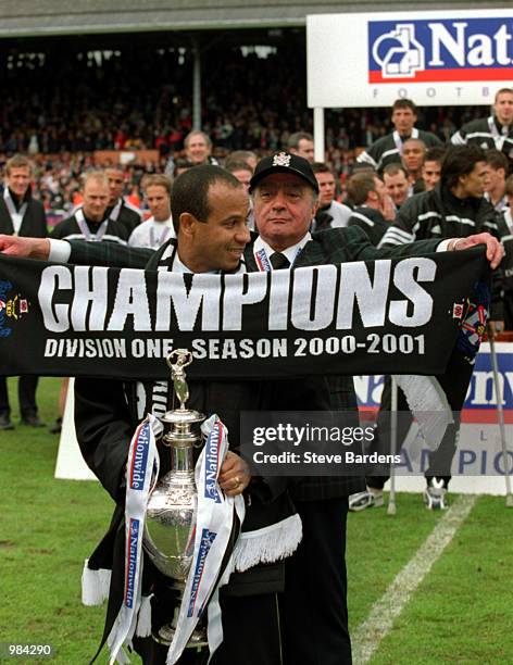 Chairman Mohamed Al Fayed and Manager Jean Tigana of Fulham celebrate with the Division One Trophy after the Nationwide Division One match between...