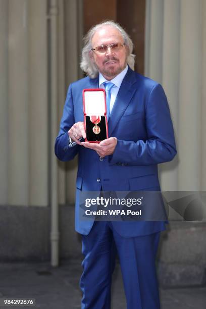 Singer and songwriter Barry Gibb poses for a photo ahead of being knighted during an investiture ceremony at Buckingham Palace on June 26, 2018 in...