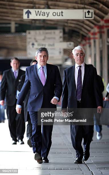 Chancellor of the Exchequer Alistair Darling and Prime Minister Gordon Brown walk to a train on April 13, 2010 in Nottingham, England. The General...
