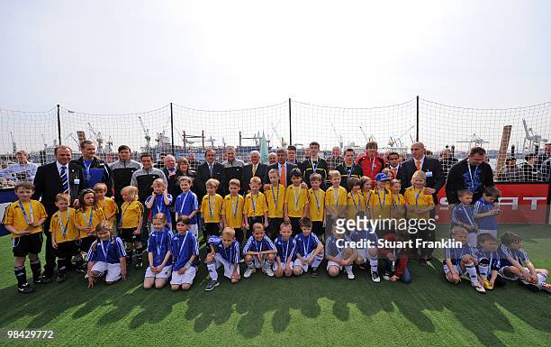 Theo Zwanziger, president of the German Football Association and Michel Platini, president of UEFA stand with the children who took part in UEFA...