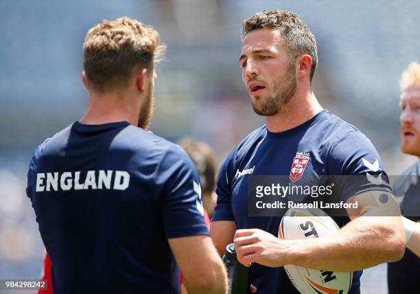 Sam Burgess of England talks with a teammate during warm-ups prior to a Rugby League Test Match between England and the New Zealand Kiwis at Sports...