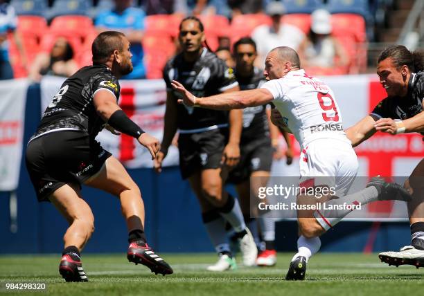 James Roby of England puts a stiff arm towards Jared Waerea-Hargreaves of New Zealand during a Rugby League Test Match between England and the New...