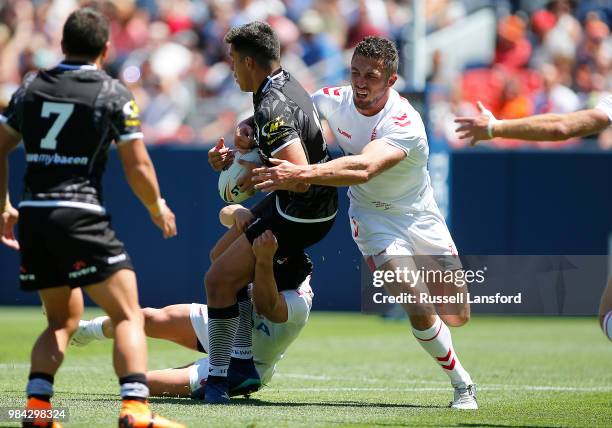 Sam Burgess of England makes a tackle on Joseph Tapine of New Zealand during the first half of a Rugby League Test Match between England and the New...