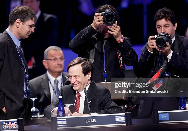 Dan Meridor, Deputy Prime Minister and Minister of Intelligence and Atomic Energy of Israel, smiles while taking his seat before a plenary session at...