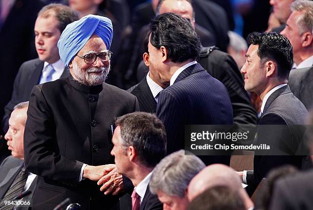 Indian Prime Minister Manmohan Singh shakes hands with the Prime Minister of Japan Yukio Hatoyama while joining world political leaders for the...