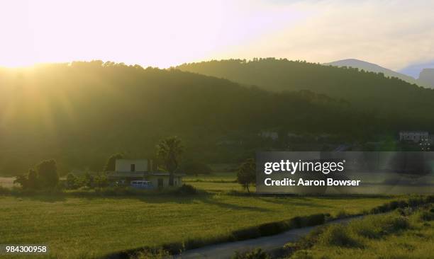 muro, spain sunset - muro stock-fotos und bilder