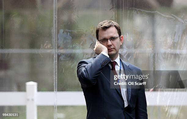 Andy Coulson, the Conservative Party's Director of Communications, speaks on the phone in Battersea Power Station following the launch of his party's...