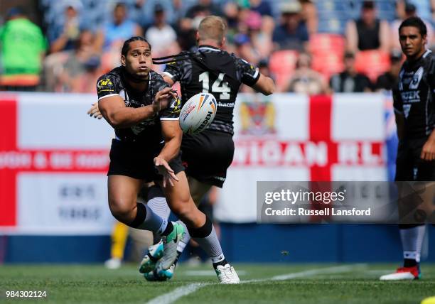 Martin Taupau of New Zealand passes the ball during a Rugby League Test Match between England and the New Zealand Kiwis at Sports Authority Field at...