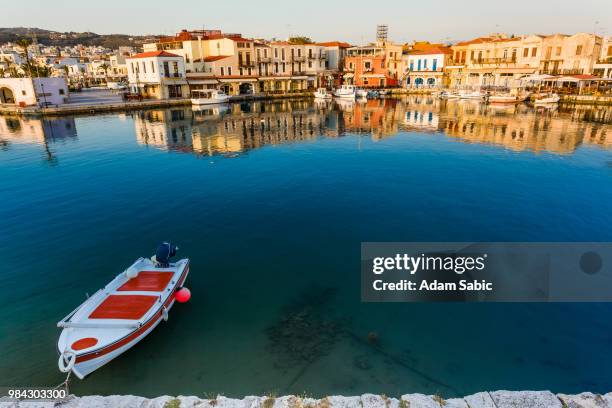 a boat at a harbour in crete, greece. - crete rethymnon stock pictures, royalty-free photos & images