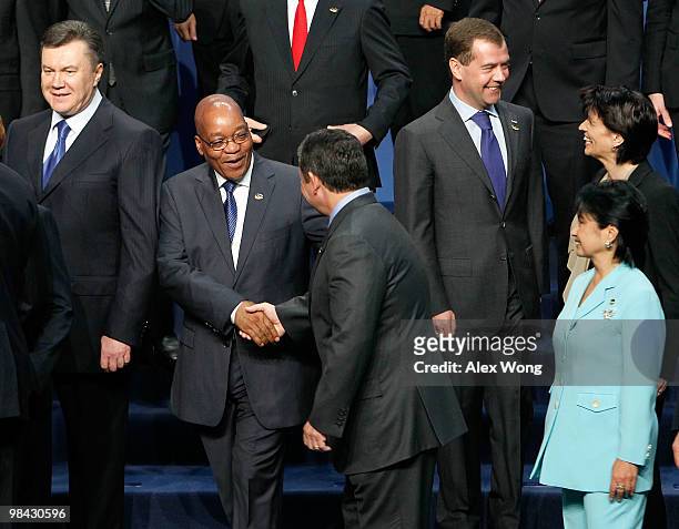 King Abdullah II of Jordan shakes hands with President of South Africa Jacob Zuma as they participate during the group photo session of the Nuclear...
