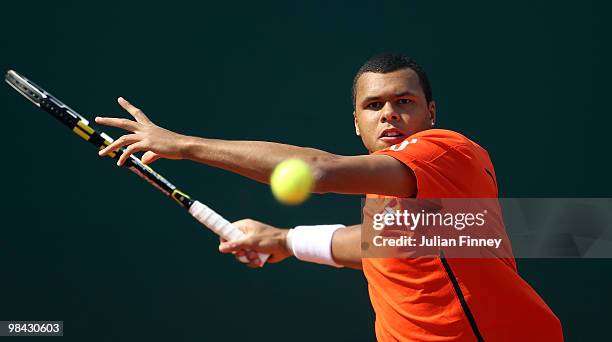 Jo-Wilfried Tsonga of France plays a forehand in his match against Nicolas Almagro of Spain during day two of the ATP Masters Series at the Monte...