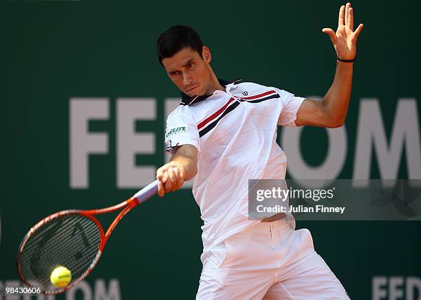 Victor Hanescu of Romania plays a forehand in his match against Stanislas Wawrinka of Switzerland during day two of the ATP Masters Series at the...