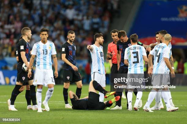 Lionel Messi of Argentina complains to referee Ravshan Irmatov during the 2018 FIFA World Cup Russia Group D match between Argentina and Croatia at...