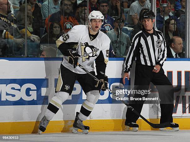 Eric Tangradi of the Pittsburgh Penguins skates in his first NHL game against the New York Islanders at the Nassau Coliseum on April 11, 2010 in...