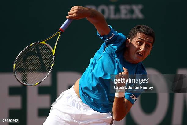 Nicolas Almagro of Spain serves to Jo-Wilfried Tsonga of France during day two of the ATP Masters Series at the Monte Carlo Country Club on April 13,...