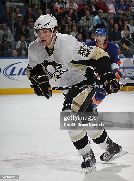 Eric Tangradi of the Pittsburgh Penguins skates in his first NHL game against the New York Islanders at the Nassau Coliseum on April 11, 2010 in...