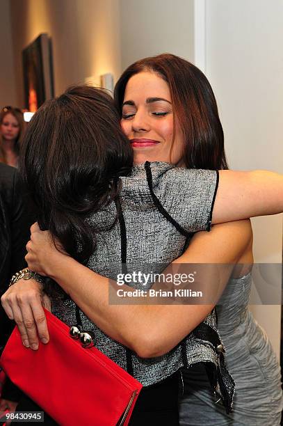 Actress Ana Ortiz hugs America Ferrera during an "Ugly Betty" charity auction at Axelle Fine Arts Gallery Ltd on April 12, 2010 in New York City.