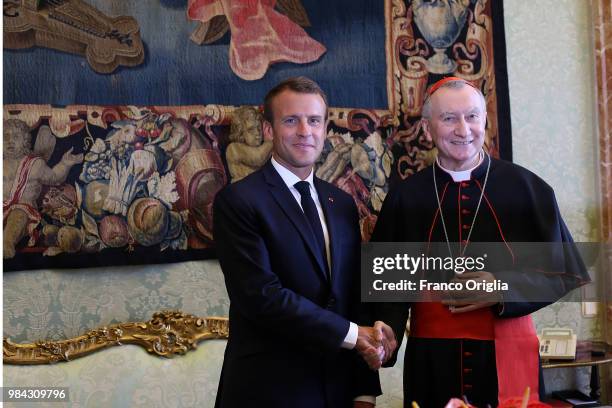 Vatican Secretary of State cardinal Pietro Parolin meets the French President Emmanuel Macron during an audience at the Apostolic Palace on June 26,...