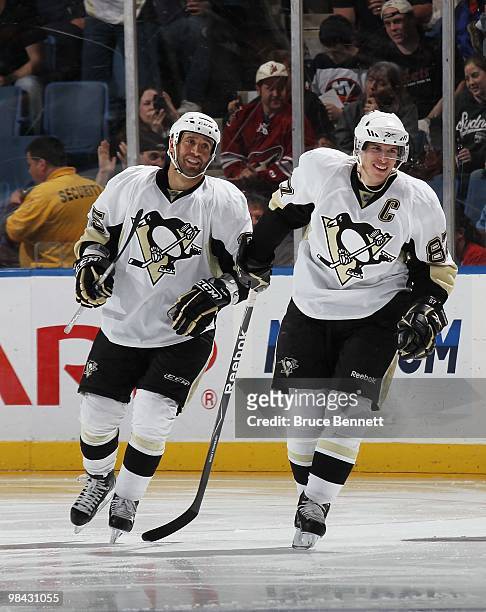 Sidney Crosby of the Pittsburgh Penguins celebrates his 51st goal with Maxime Talbot in the second period against the New York Islanders at the...