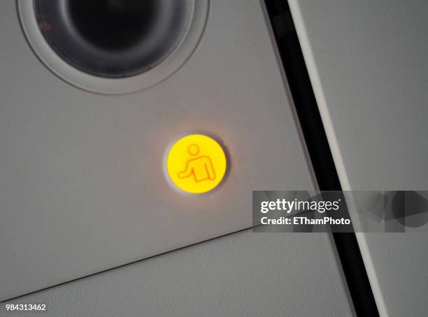 flight attendant call button on ceiling inside passenger aircraft cabin - crew stock pictures, royalty-free photos & images