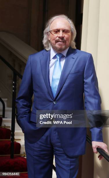 Singer and songwriter Barry Gibb poses for a photo ahead of being knighted during an investiture ceremony at Buckingham Palace on June 26, 2018 in...