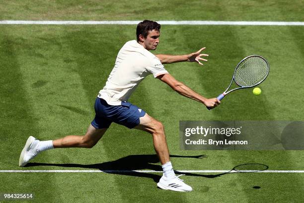 Gilles Simon of France in action against Leonardo Mayer of Argentina during day five of the Nature Valley International at Devonshire Park on June...