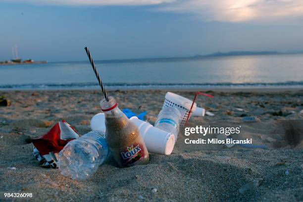 Plastic cups used by tourists on the Aegean sea beach near Athens on June 26 Greece . The Mediterranean is one of the seas with the highest levels of...