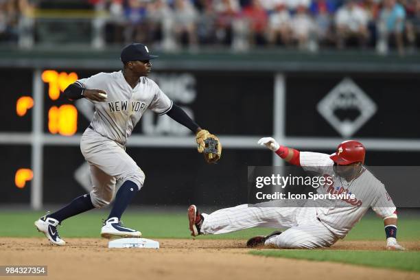 New York Yankees Shortstop Didi Gregorius forces out Philadelphia Phillies First base Carlos Santana during a Major League Baseball game between the...
