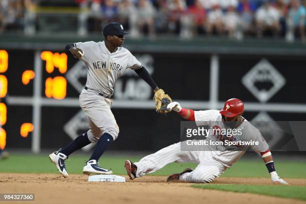 New York Yankees Shortstop Didi Gregorius forces out Philadelphia Phillies First base Carlos Santana during a Major League Baseball game between the...