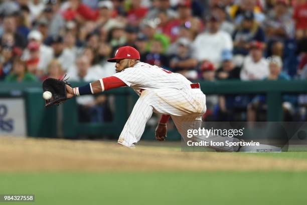 Philadelphia Phillies First base Carlos Santana reaches for the ball during a Major League Baseball game between the New York Yankees and the...