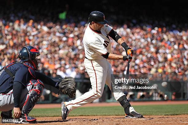 Mark DeRosa of the San Francisco Giants bats against the Atlanta Braves on Opening Day at AT&T Park on April 9, 2010 in San Francisco, California.