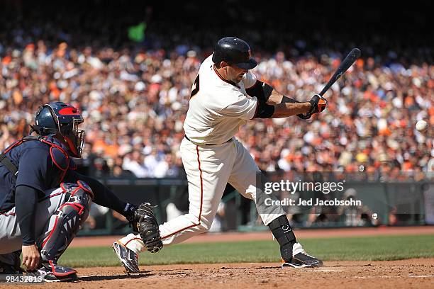 Mark DeRosa of the San Francisco Giants bats against the Atlanta Braves on Opening Day at AT&T Park on April 9, 2010 in San Francisco, California.